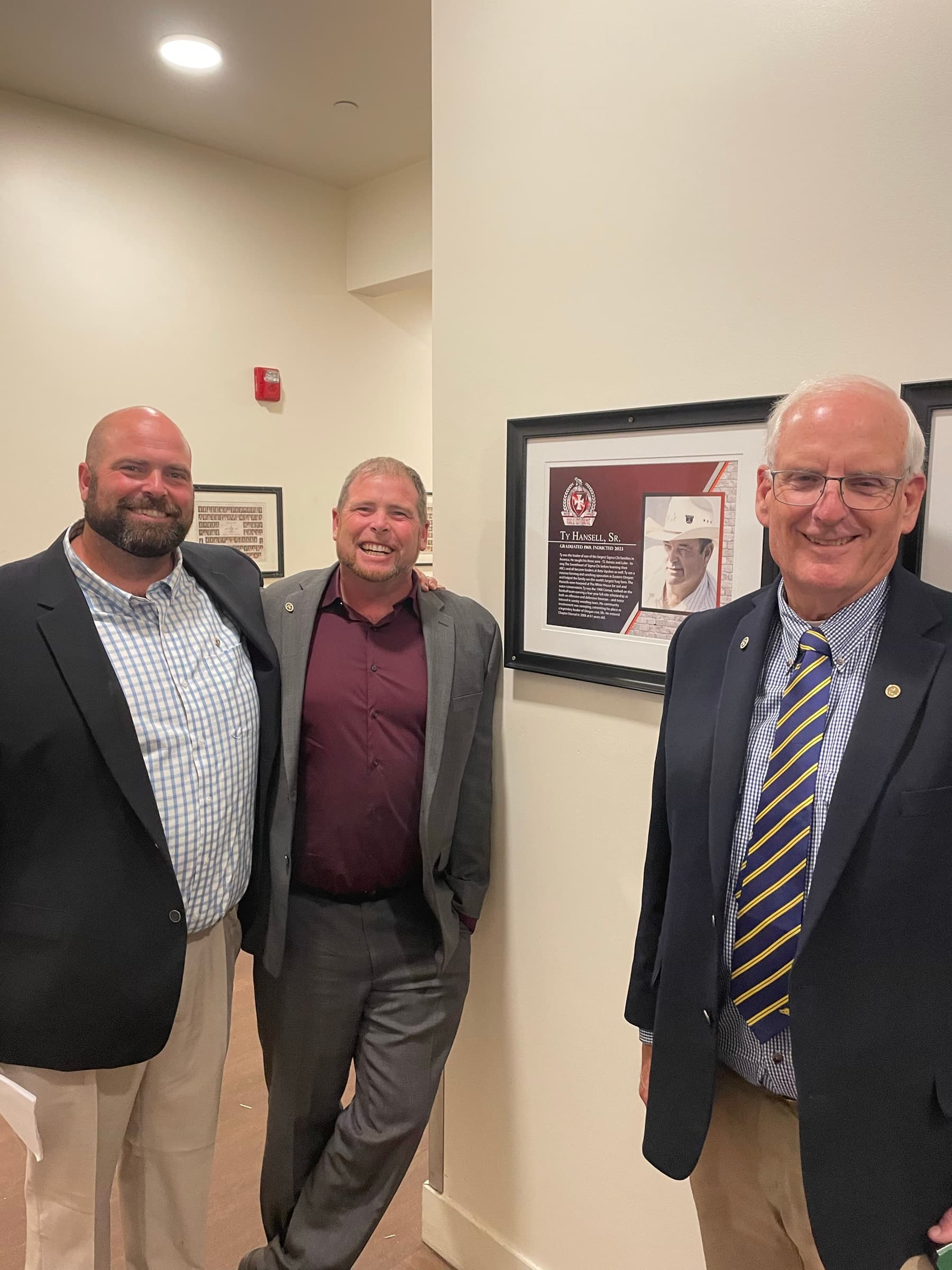 TJ with a community leader at a formal event